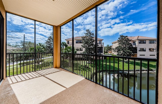 sunroom with a water view