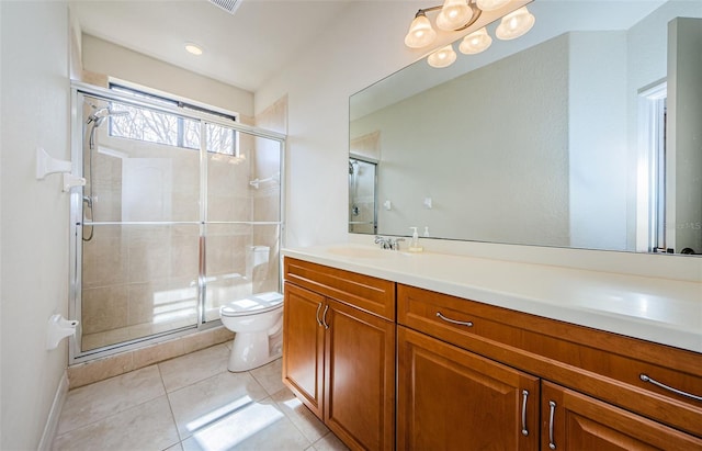 bathroom with tile floors, toilet, a shower with shower door, and oversized vanity