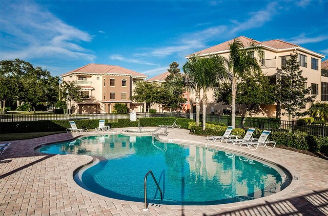 view of swimming pool with a patio area