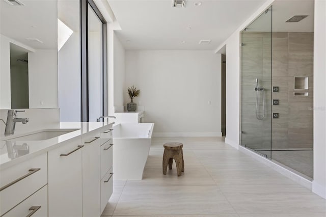 bathroom featuring independent shower and bath, tile floors, and large vanity