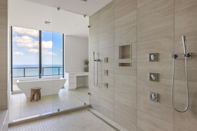 bathroom with tile floors and a water view