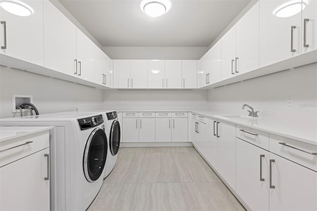 washroom featuring light tile flooring, cabinets, hookup for a washing machine, independent washer and dryer, and sink