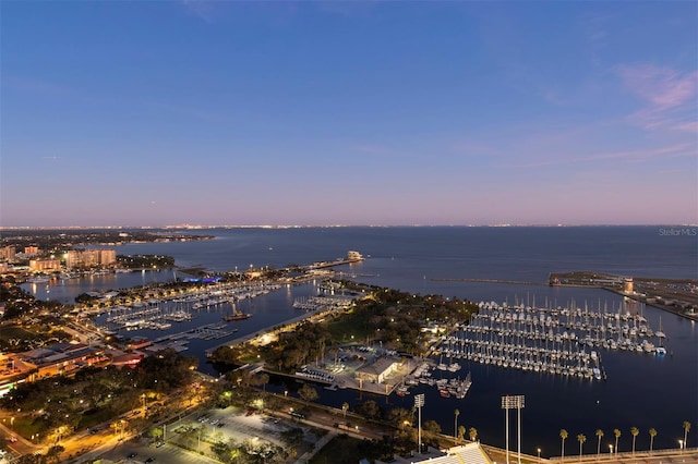 aerial view at dusk with a water view