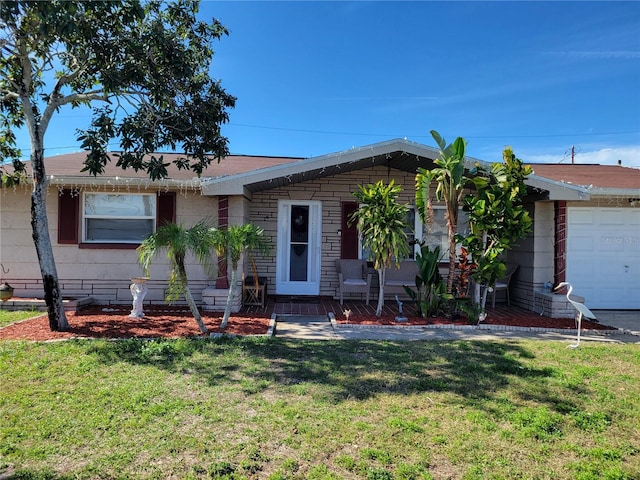 single story home with a front lawn and a garage