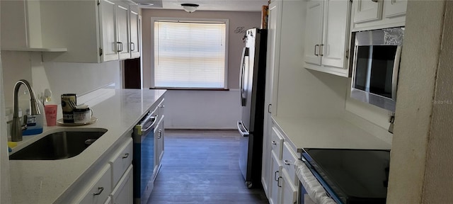 kitchen with white cabinetry and stainless steel appliances