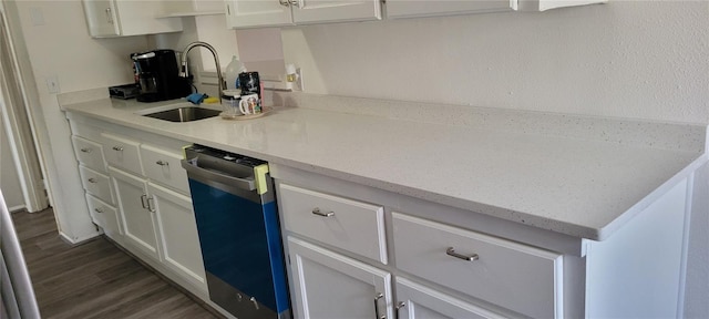 kitchen featuring light stone counters, dishwasher, dark hardwood / wood-style flooring, white cabinets, and sink