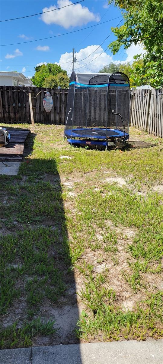 view of yard with a trampoline