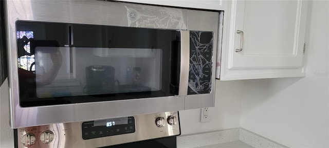 details featuring white cabinetry