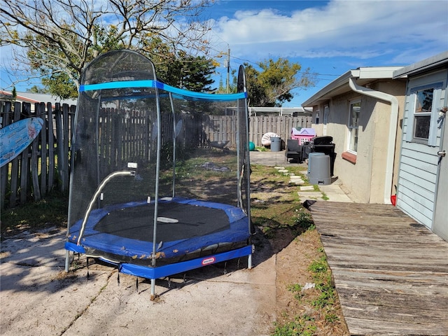 view of yard with a trampoline