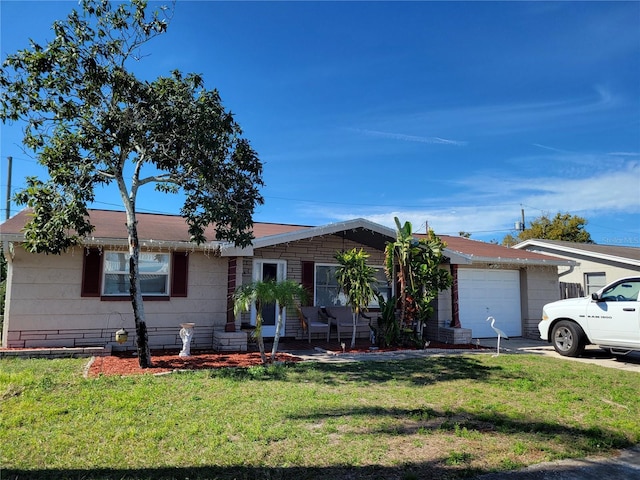 ranch-style home with a garage and a front yard