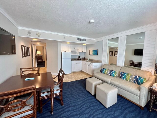 carpeted living room with a textured ceiling, sink, and ornamental molding