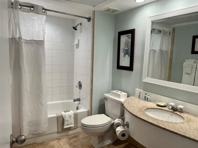 full bathroom featuring shower / tub combo, toilet, tile floors, and vanity