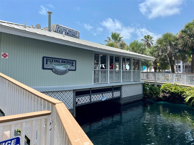 back of house with a water view