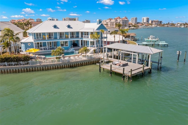 dock area featuring a balcony and a water view