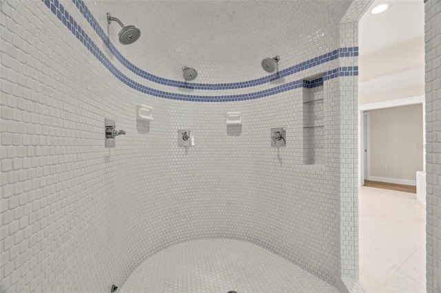 bathroom with tiled shower