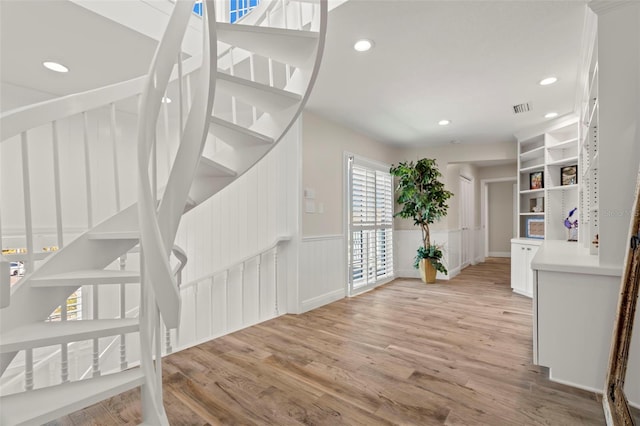 stairway featuring hardwood / wood-style floors