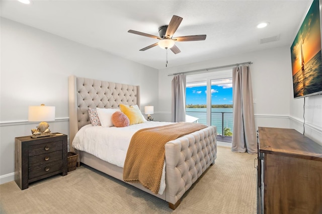 carpeted bedroom with ceiling fan and access to outside