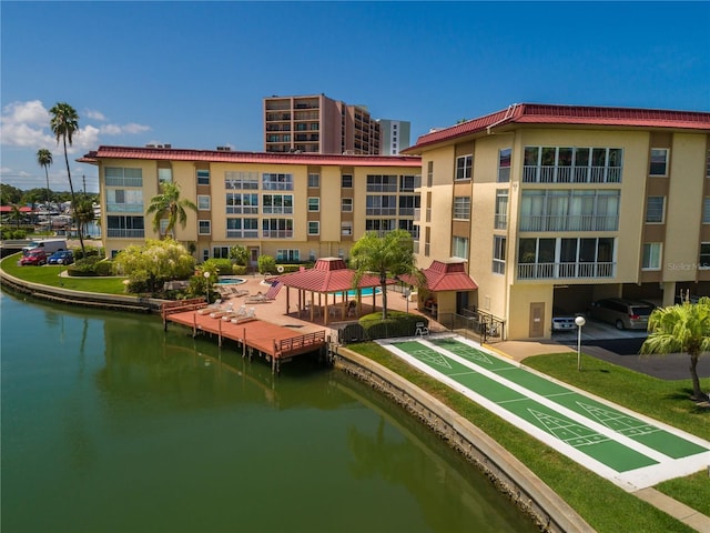 exterior space featuring a gazebo and a water view