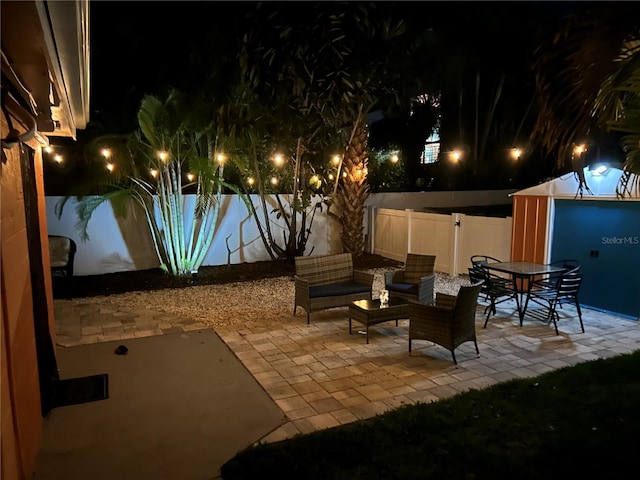 view of patio terrace at night