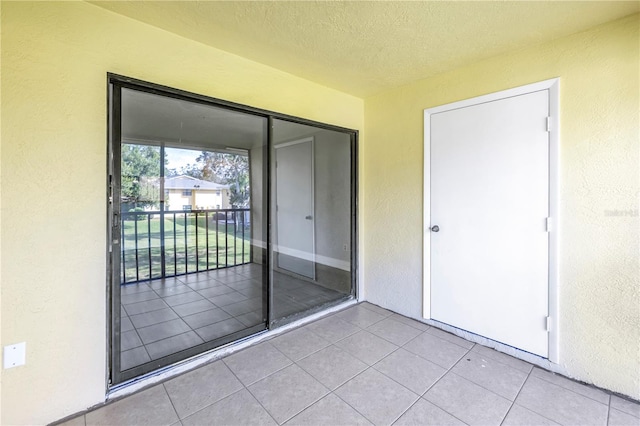 entrance to property featuring a balcony