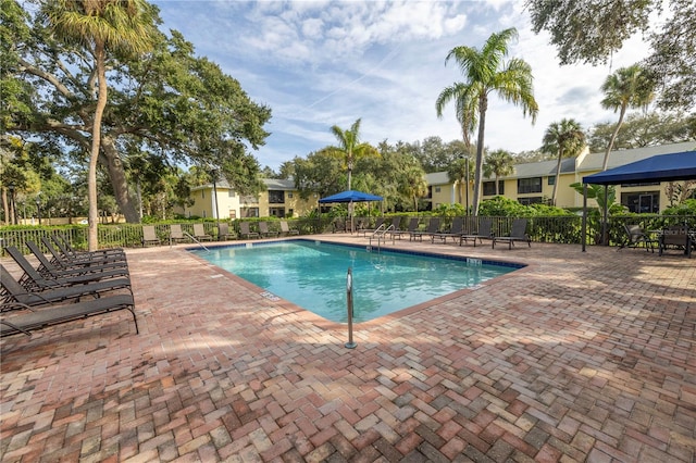 view of swimming pool featuring a patio