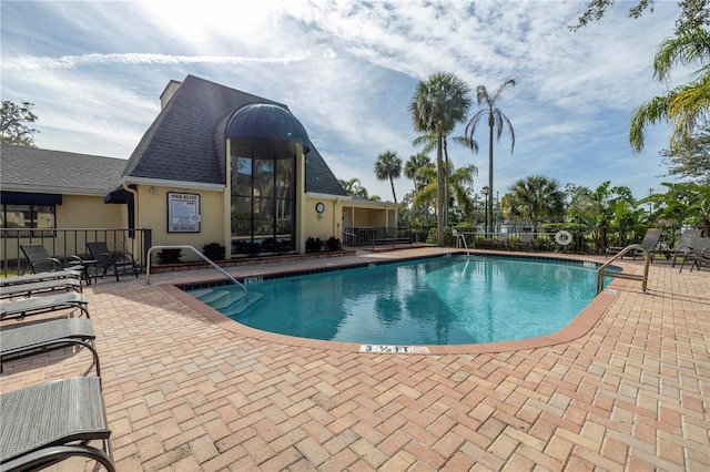 view of pool featuring a patio