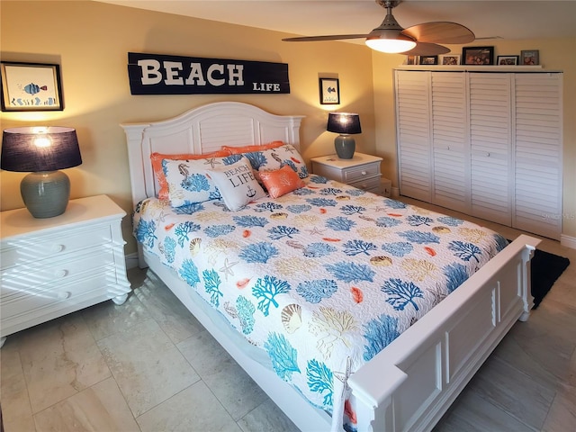 tiled bedroom with ceiling fan