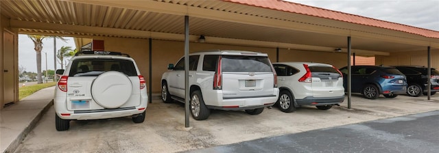 view of parking / parking lot featuring a carport