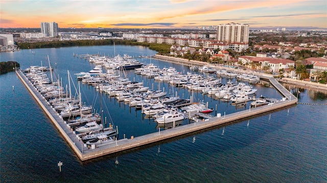 aerial view at dusk with a water view