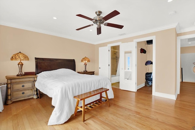 bedroom with a walk in closet, ensuite bath, ceiling fan, light wood-type flooring, and a closet