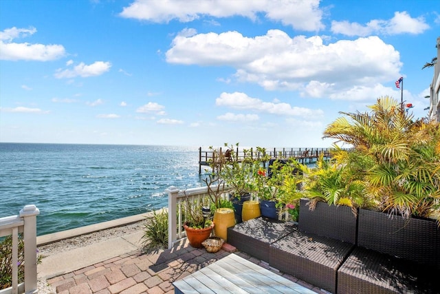 balcony featuring an outdoor hangout area and a water view