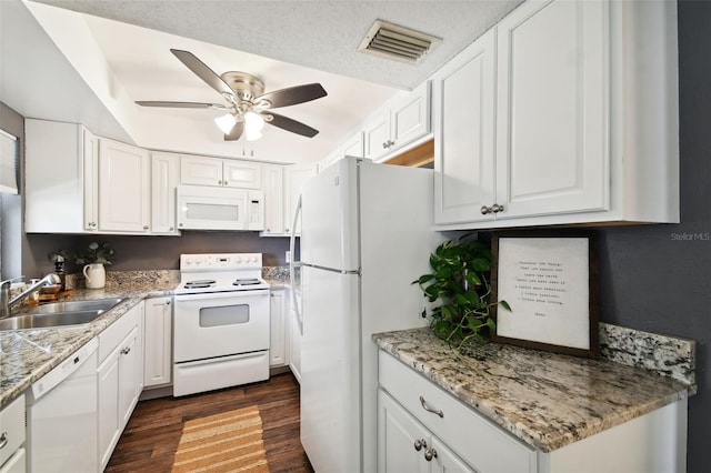 kitchen featuring sink, white appliances, dark hardwood / wood-style floors, ceiling fan, and white cabinets