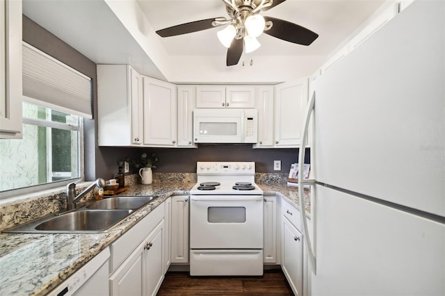 kitchen with white cabinetry, dark hardwood / wood-style floors, sink, white appliances, and ceiling fan