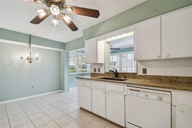 kitchen featuring light tile patterned floors, white cabinets, white dishwasher, and sink