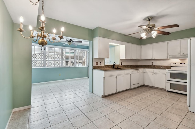 kitchen featuring white appliances, ceiling fan with notable chandelier, light tile patterned flooring, and white cabinetry