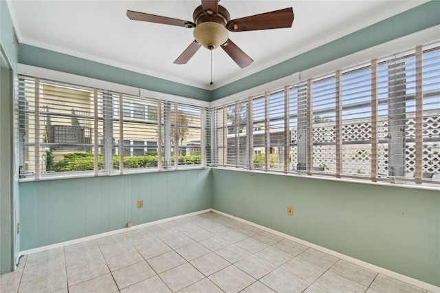 unfurnished sunroom with ceiling fan