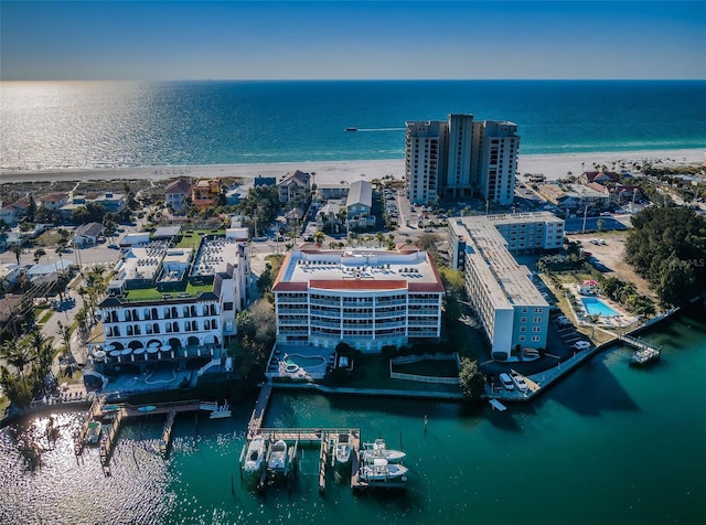 drone / aerial view with a beach view and a water view