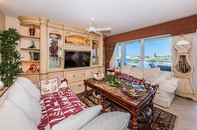 living room with light tile floors and built in features