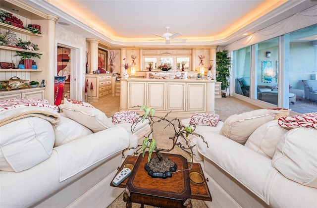 living room with light colored carpet, ceiling fan, and a tray ceiling