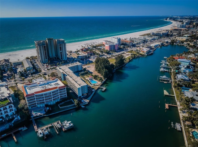 bird's eye view with a water view and a beach view