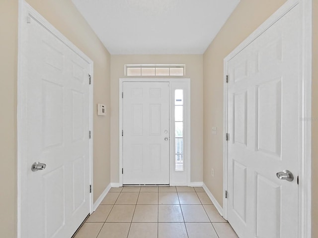 entryway with light tile flooring