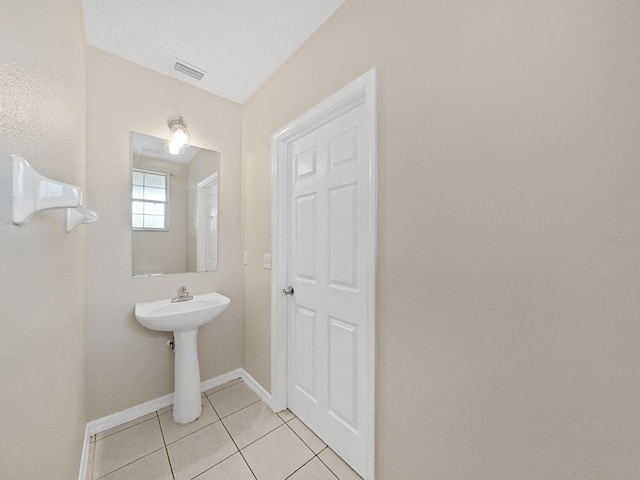 bathroom featuring tile floors