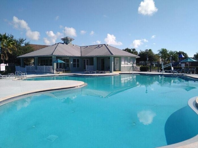 view of swimming pool featuring a patio area