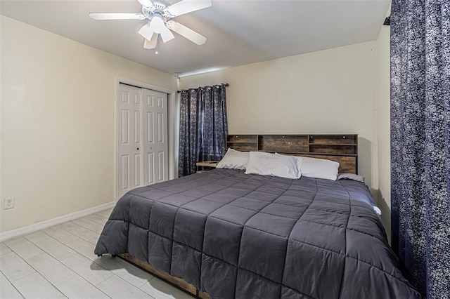bedroom featuring a closet, baseboards, and ceiling fan