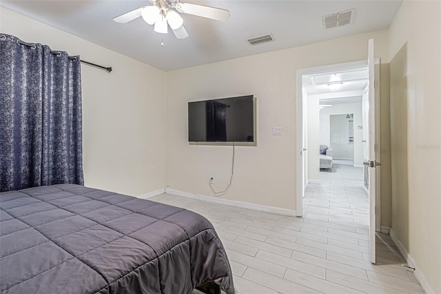 bedroom featuring light wood-style flooring, baseboards, and visible vents