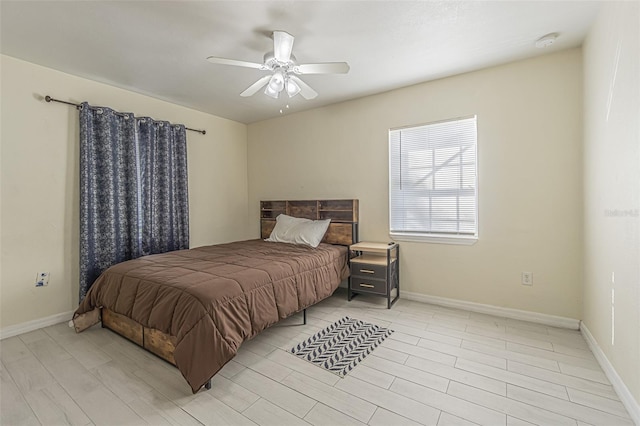 bedroom featuring a ceiling fan and baseboards