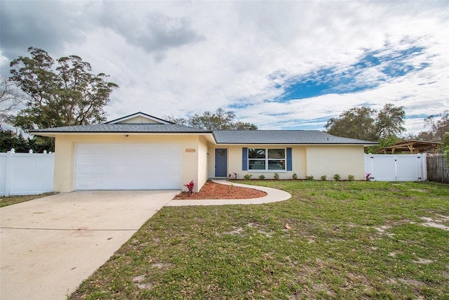 single story home with a garage and a front lawn