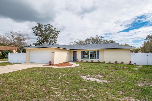 ranch-style house featuring a garage and a front lawn