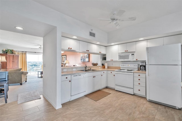 kitchen with white cabinets, white appliances, ceiling fan, and sink