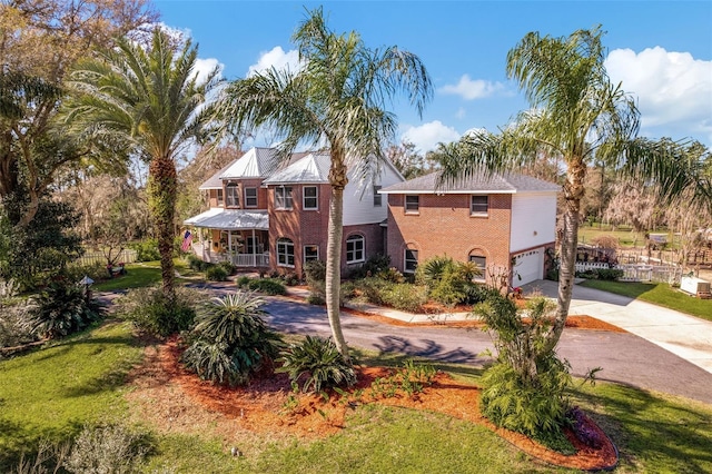 view of front of house featuring a front yard and a garage